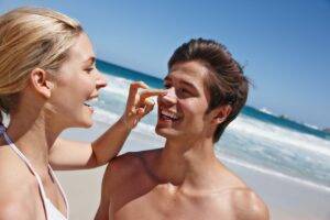 shot of a happy young woman applying sunscreen to 2025 04 06 12 30 32 utc scaled