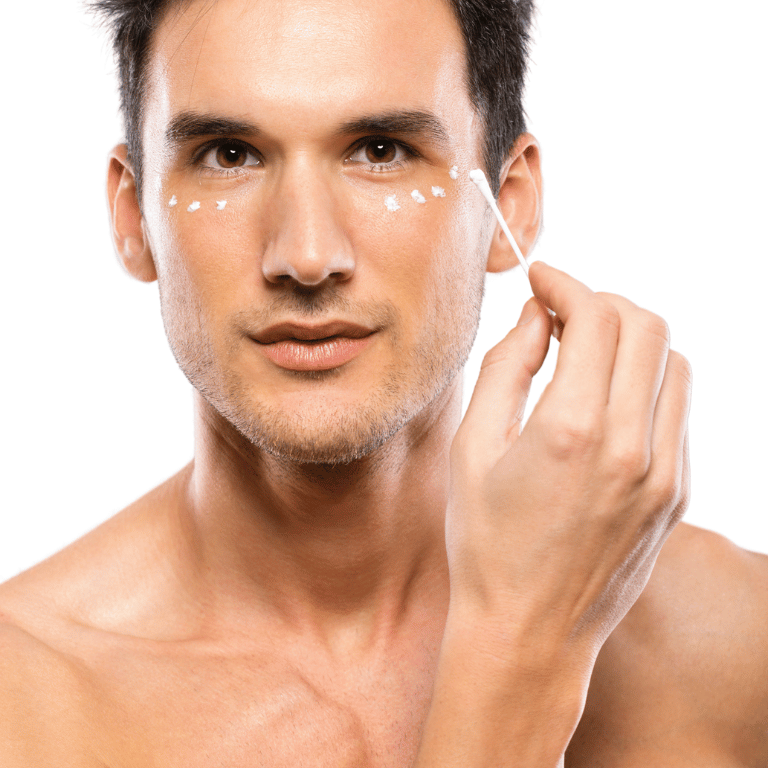 Rejuvenecimiento Facial sin Cirugía | Piel Joven y Radiante Hombre aplicando tratamiento en la zona de los ojos, representando el rejuvenecimiento facial sin cirugía para mejorar la firmeza y luminosidad de la piel.